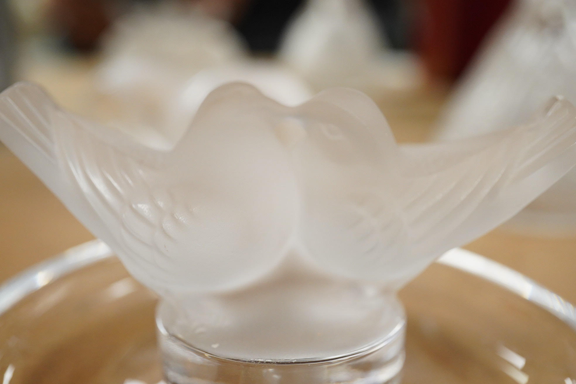 A Lalique scent bottle with stopper, a Lalique lovebirds pin-dish and and a Lalique heart-shape knot, scent bottle 12cm